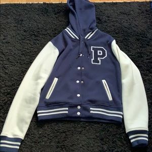 Letterman jacket with detachable hood.
